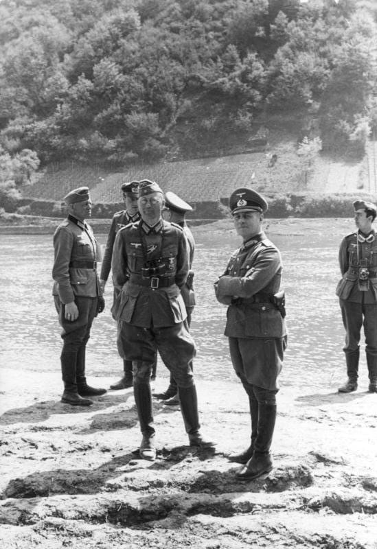 General Erwin Rommel and his staff observe troops of the 7th Panzer Division in France in 1940. His division was named he Ghost Division during the Fall of France, because it had a habit of showing up at the most unexpected places.