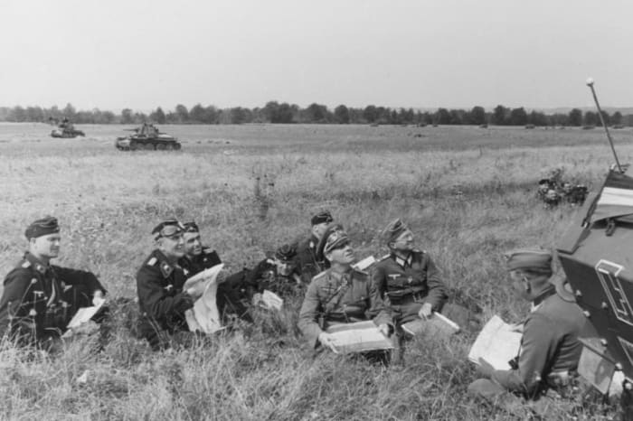 Rommel and staff during the Battle of France, June 1940, looking up at the air battle above them. He always led from the front, near the edge of the sword, often putting him in jeopardy of enemy fire.