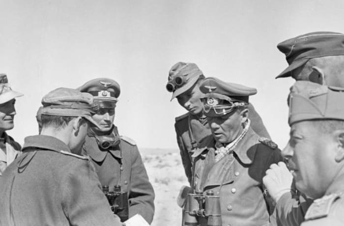 Rommel conversing with his staff near El Agheila, 12 January 1942. Soon afterward he would lead his Africa Korps on a grand march toward the Egyptian border.