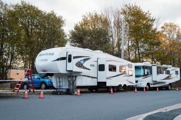 The trailer aka "Team Rex" on location has an office for trainer Sherri Davis and was custom-built for the dogs in the show