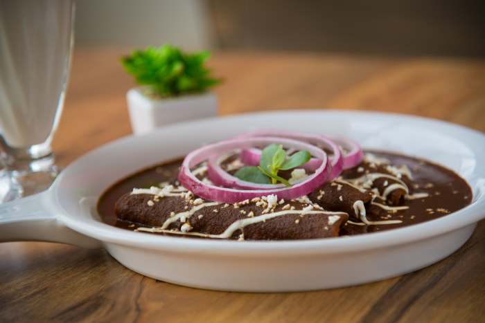 Traditionally, enchiladas are rolled, but the slow cooker method solves the problem of easily breakable corn tortillas.