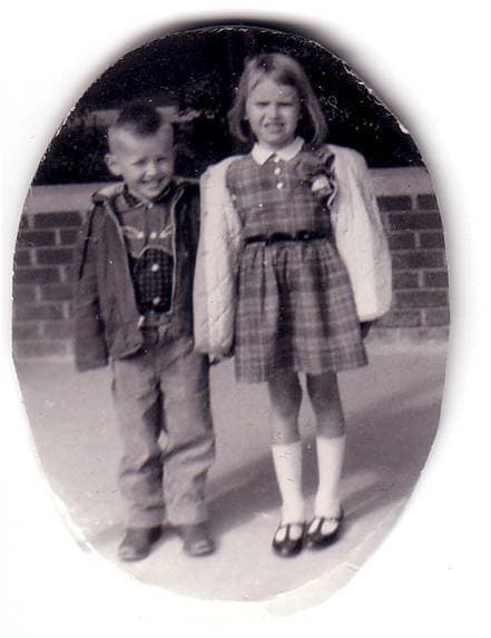 First day of school. That's my brother, Ed, or Eddie, as we used to call him as a child, who is a year younger than I am. I don't look too happy. Apparently, my mother loved plaid dresses. Looks like I am wearing a drooping rose corsage ...