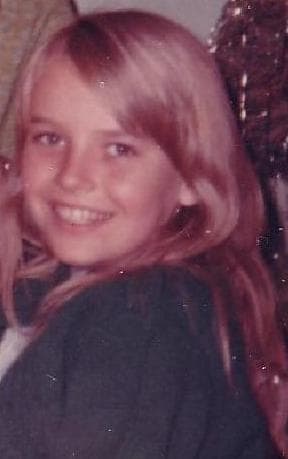 That's me; the girl with the crooked smile. The photo is old and has specs, as you will note.