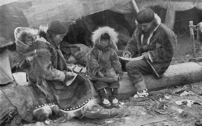 An inuit family (1917) - "AN ESKIMO FAMILY. Tenderness and responsibility in their treatment of children is a virtue of the Eskimo which binds them closer to the brotherhood of civilized peoples."
