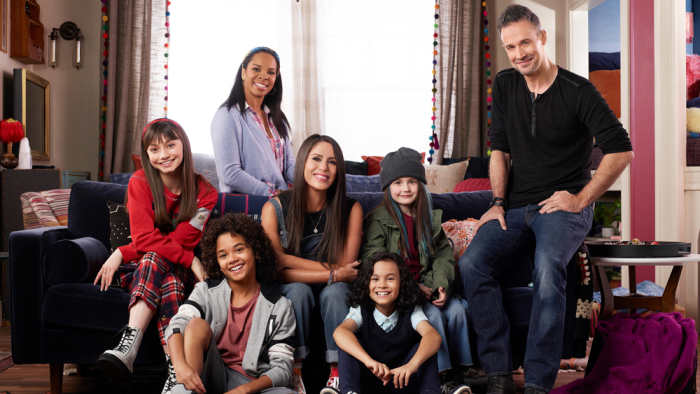 Soleil Moon Frye (middle, center row) plays her iconic Punky Brewster character who juggles being a single mother of three with taking in a young lady who reminds her a lot of her younger self in the new Punky Brewster revival on Peacock.