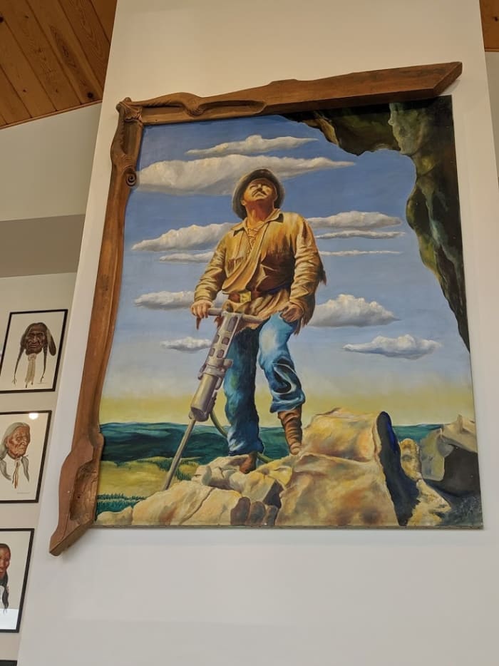 Korczak Ziolkowski working on the head of Crazy Horse painted by Dean Nauman. Korczak made a frame but only framed half, with the other half to be added when the memorial is finished.
