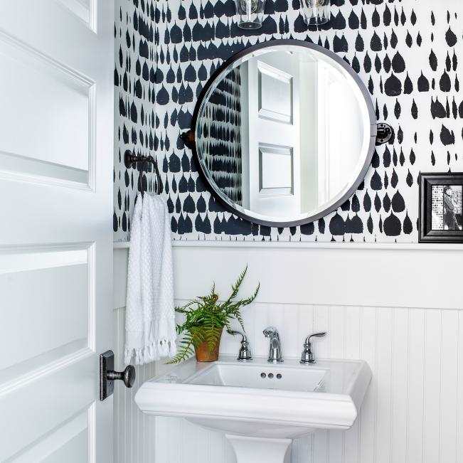 When you've completed all of the upgrades, you can begin planning the interior of your powder room. The black and white color scheme is timeless and works well in every print or pattern.