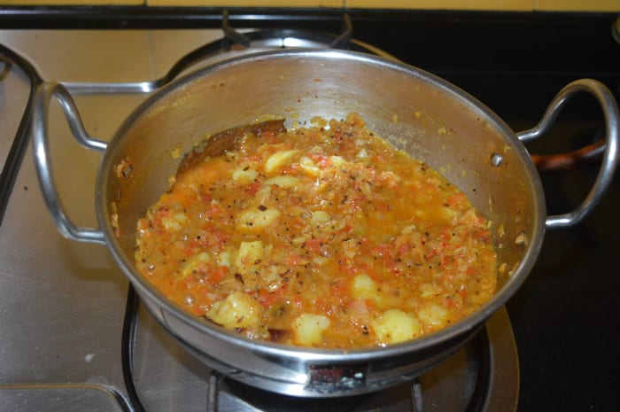 Saute the mixture for 2 minutes. Add a cup of water and simmer for 2-3 minutes until the curry becomes semi-solid. Check for taste. Add salt or red chili powder if needed.