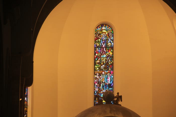 This stained glass window located right on top of the altar depicts the Queenship of Mary (Photo by the author)