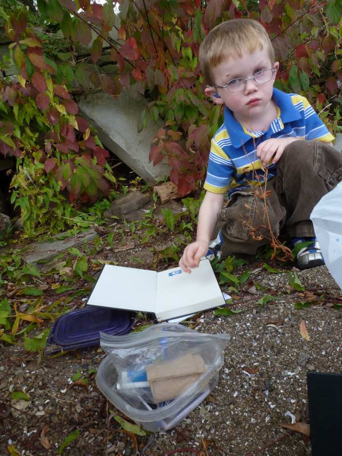 A four year old with a letterbox and a sketchbook to record the hand-carved stamp inside the box. The box was carefully re-hidden once we had logged in and obtained our stamp!