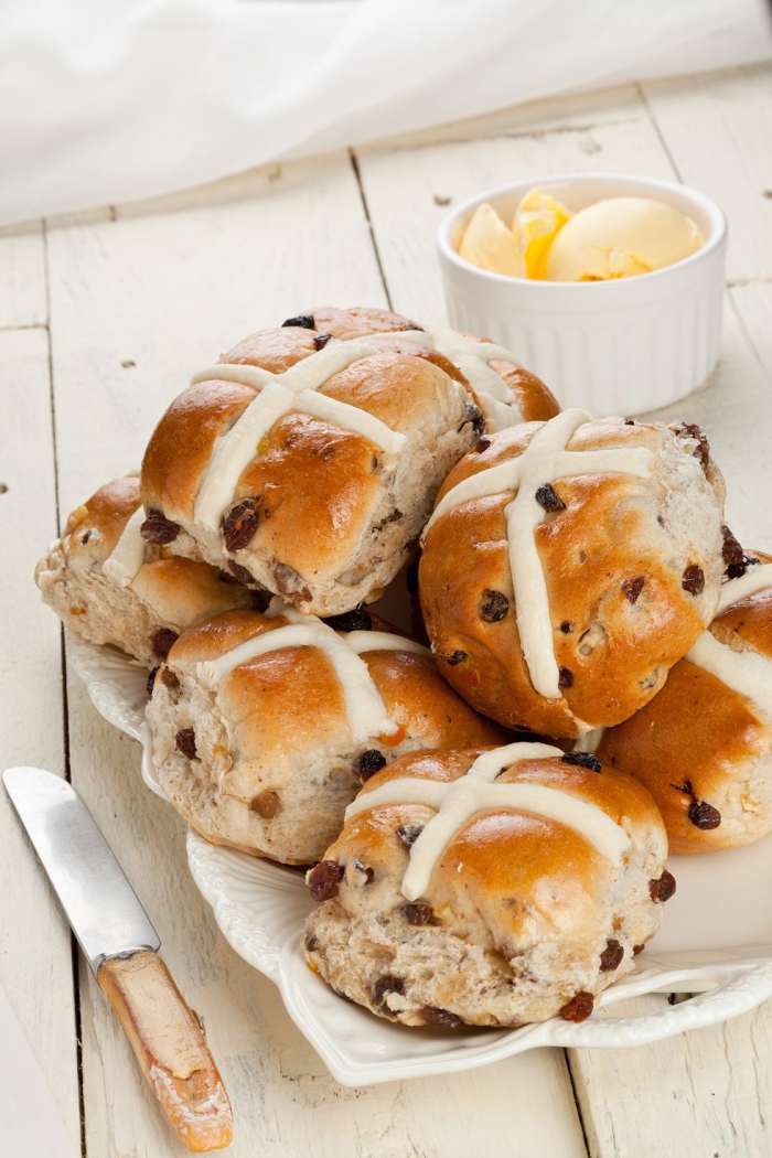 Hot cross buns made with raisins, candied citrus peel, and crosses of sweet white icing, have long delighted families on Easter morning, and if any are left over, they end up on the dinner table.
