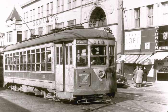 No. 7 trolley winds its way up Main Street heading toward Yonkers Avenue in Yonkers, N.Y. Genung's Department Store can be seen in background. Trolleys were replaced in Yonkers with buses in November 1952.