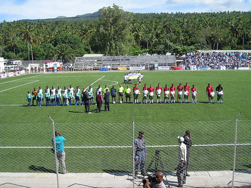 Players from Comoros (white) and Madagascar (red) line up ahead of a matchup in 2007 at Stade Said Mohamed Cheikh in Mitasouli, Comoros. This 2010 AFCON/WC qualifier was the first game Comoros hosted since first playing internationally in 1979.
