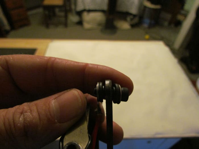 The front binding post has been removed here, look at the washers and how they are in order. Refer to your tattoo machine or the diagram I provided above.