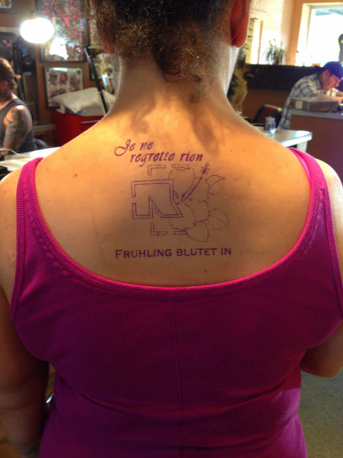 The tattoo artist creates a stencil (seen above). He then applies the stencil to your body. This is the time to check all elements of the design VERY carefully.