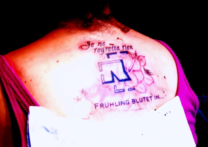 Translated, the words read, "I regret nothing, spring bleeds in..." These are lyrics from my favorite Rammstein song, "Fruhling in Paris." I chose not to include "Paris" because the city has no special meaning for me.