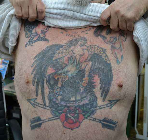Sailor Eddie's chest art was inked by tattoo artist Mike Wilson during a visit to Ed's shop. Sailor Ed tattooed Wilson's chest piece on the same visit.