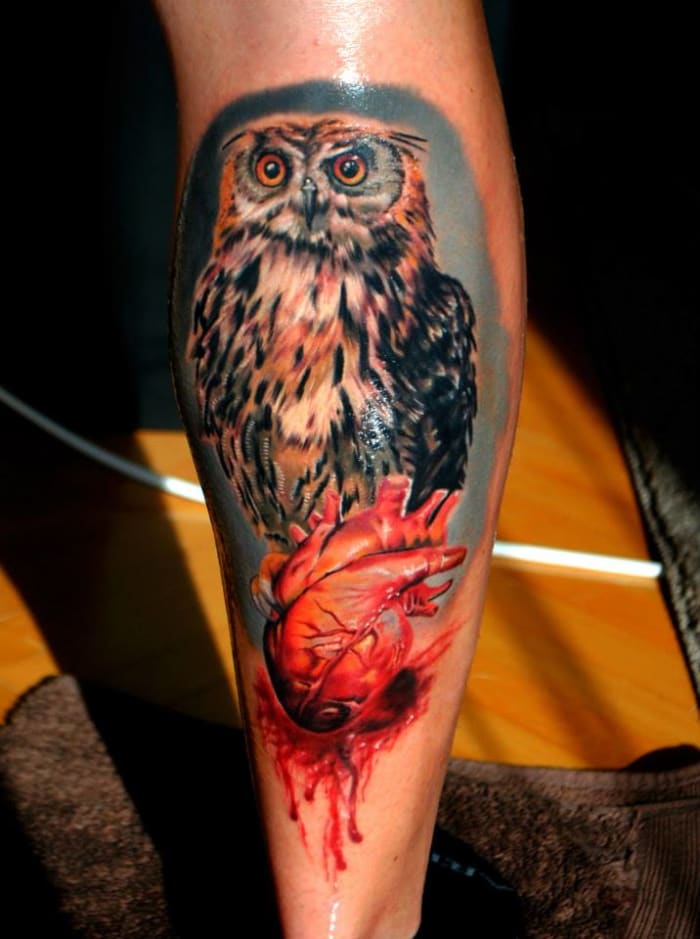 An amazing owl tattoo. It shines because tattoo aftercare cream has been rubbed in by the tattoo artist.