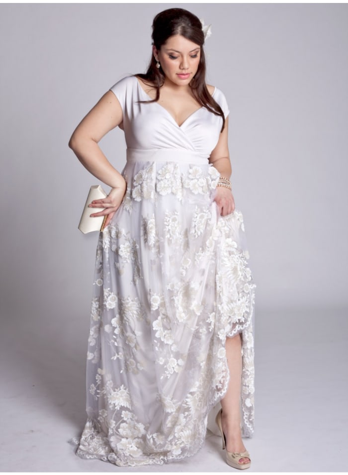 Wedding dress from Igigi. Notice how the body-hugging top makes the most of the bride's figure, while it gently skims over less toned areas, such as the tummy and hips.