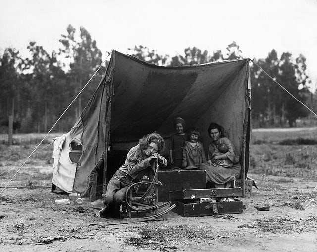Family in the Great Depression living in a makeshift tent.