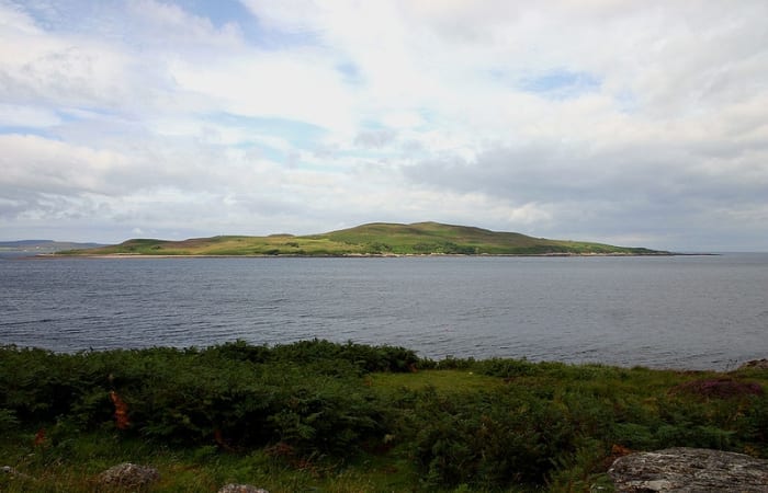 500 acre Gruinard Island seen from the northwest Scottish coast. The island was quarantined for nearly 50 years because of anthrax contamination as a result of biological weapons testing during World War 2.