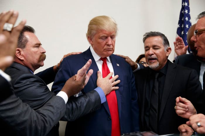 Pastors from the Las Vegas area pray with Republican presidential candidate Donald Trump during a visit to the International Church of Las Vegas, and International Christian Academy on Oct. 5, 2016, in Las Vegas, Nev.