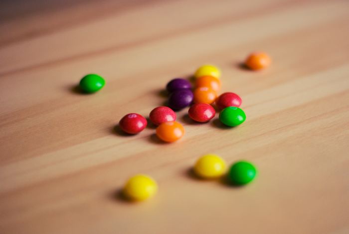 Skittles candies can be used to play an educational and delicious game that teaches about risk versus return.