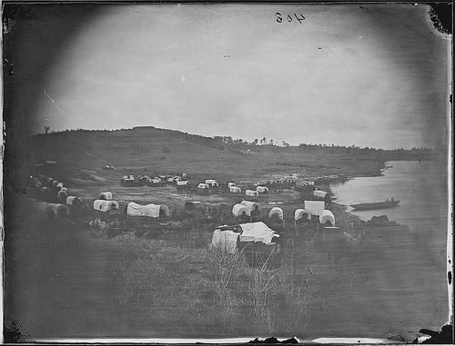 Oklahoma Attracted settlers from all over. This picture shows a wagon train heading towards Oklahoma Territory.