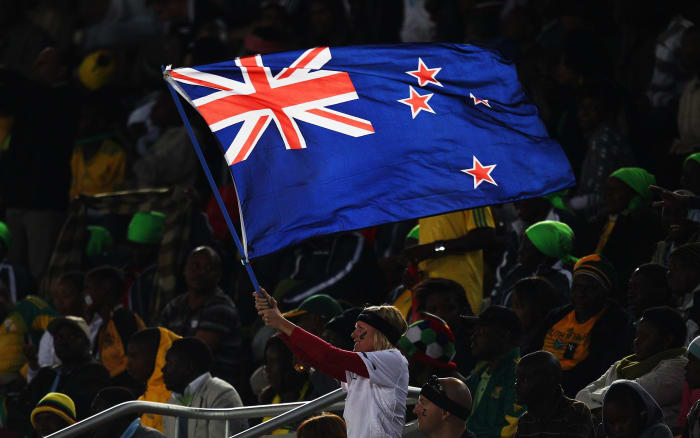 A fan waves New Zealand's flag during a World Cup match against Paraguay in Polokwane, South Africa.