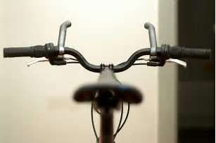 Note how some bar ends fit on the end of the handlebars and some as these shown fit closer to the middle. Bar ends being shown on the handle bars from the riders view.
