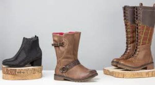 Wear thicker or an additional pair of socks. Thick socks will add extra bulk to your feet and provide a tighter fit inside your shoe. This option works well for boots and walking shoes, too.