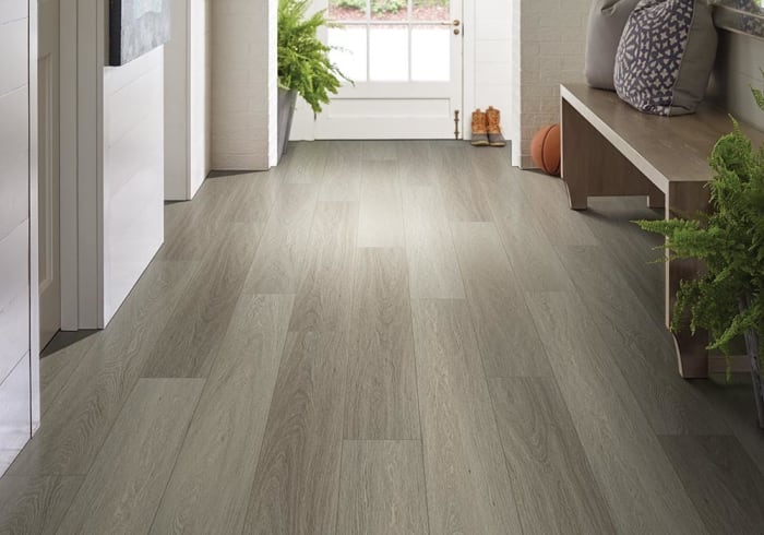 One of the moisture tolerant flooring options is luxury vinyl. Many of the lines are totally water resistant.