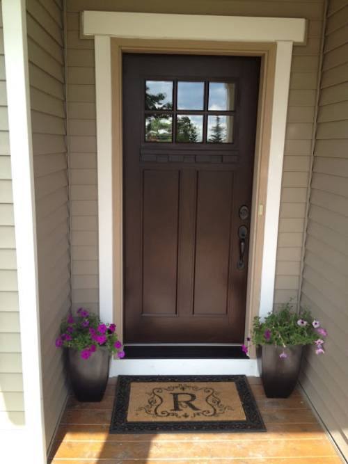 The dark brown door is a paint shade. The chocolate-brown door paint with a hint of adds a harmonious element.