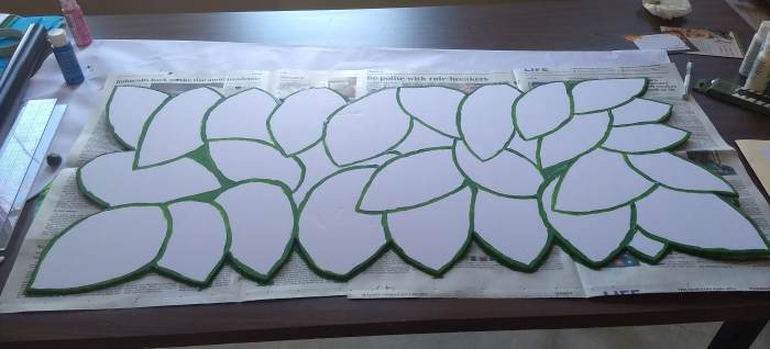 This is an in-progress shot of the leaves we created to modify the Lenten panels into Easter panels.