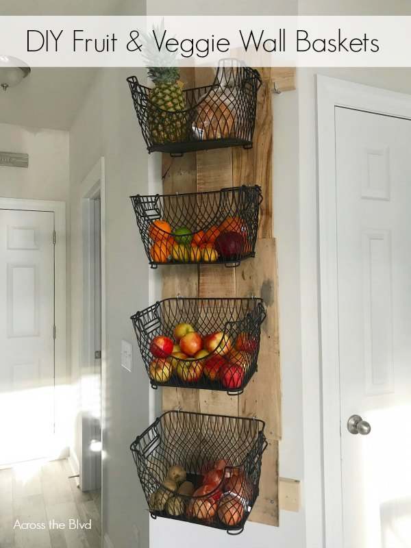 This DIY wall mounted fruit and veggie holder is a stylish and convenient way to store fruits and vegetables.