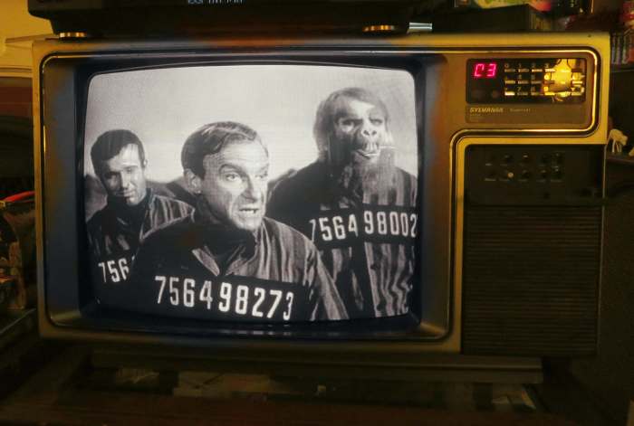 Don West and Doctor Smith look completely miserable on the Prison Planet, but Creech, played by Michael Conrad seems to not care.