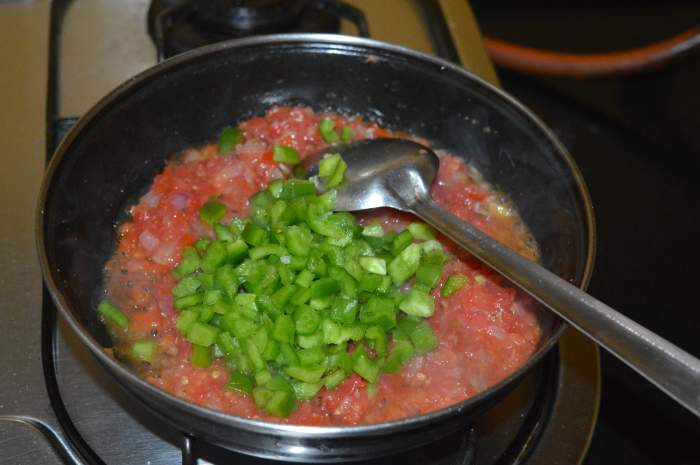 Add chopped capsicum. Saute the mixture for 3 minutes or until the tomatoes become mushy. By now, the mixture should be almost dry. Lower the heat.