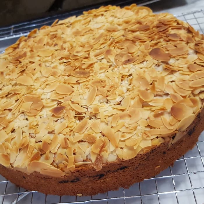 Brown butter cake with freeze-dried plums and Davidson plum powder. You can just see the streaks of the added red fruits coming through on the sides.