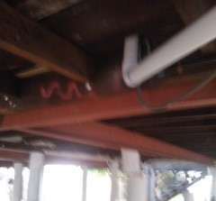 Here the steel beams have been set in place and bolted to the timber bears of the house. These beams can carry more weight at a longer distance and some posts could be eliminated
