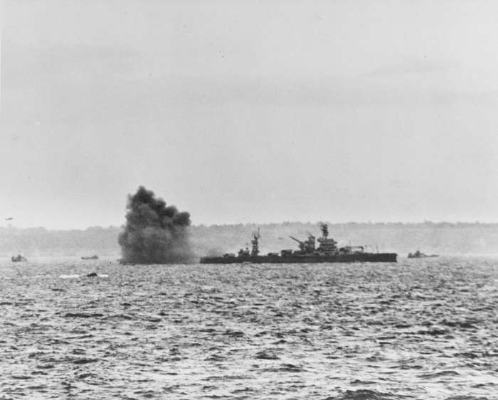 The American Battleship Arkansas engaging German shore batteries off Omaha beach June 6,1944.