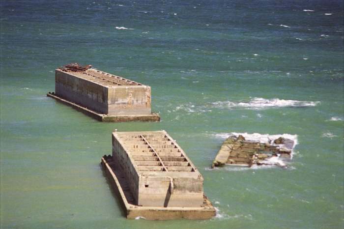 Mulberry harbors today in the surf off Normandy massive concrete monuments to the battle for Normandy D-D June 6, 1944.