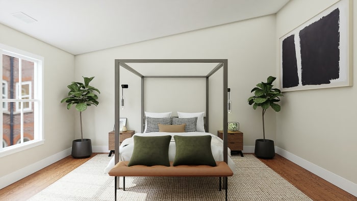Notice the olive green, sandy and black and white pillows, along with vibrant green plants, tied together with neutral bedding and a similar neutral colored, TEXTURED rug