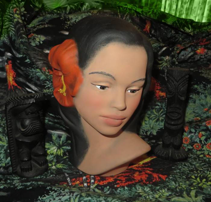 The flower on this beautiful bust is a red hibiscus, and rightly so it should be one. The women of Hawaii have always loved wearing hibiscus flowers the red ones seems to be the color most seen on the Islands of Hawaii. But there are many shades of h