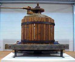 This is very much like the wine press I am talking about, except that there are no cast iron wheels to move it from place to place.