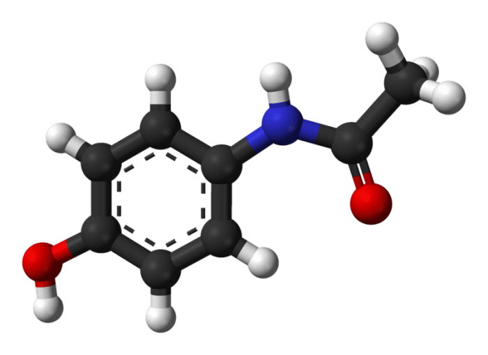 This is a ball-and-stick model of an acetaminophen molecule. Black balls = carbon atoms, grey balls = hydrogen atoms, blue ball - nitrogen atom, red balls = oxygen atoms.
