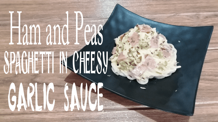 Make this ham and peas spaghetti in a cheesy garlic sauce at home with this easy-to-follow recipe.