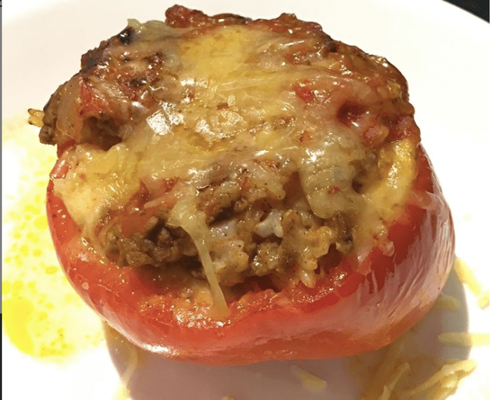 Slow-cooked beef, rice, and tomato stuffed capsicums (bell pepper)