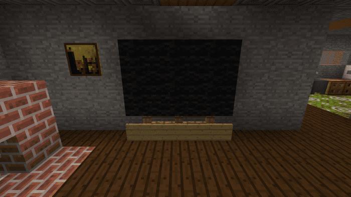 This TV was made with six black wool blocks, three fence posts and three signs.