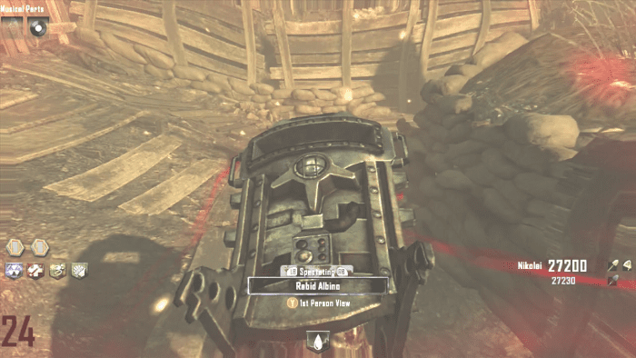 You can see the invisible zombie while you have an active Zombie Blood Power-Up. His red eyes give him away.