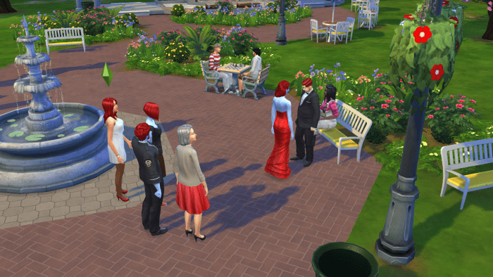 Two sims getting married at a park in "The Sims 4." Satisfy the guests for some marital bonuses.